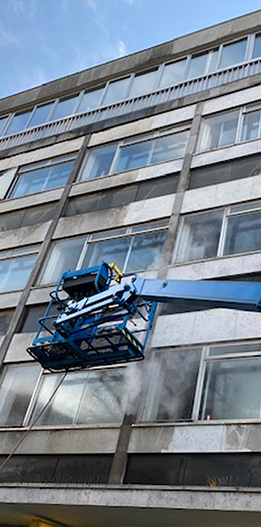 commercial pressure washing being carried out by Locus operatives on a commercial building
